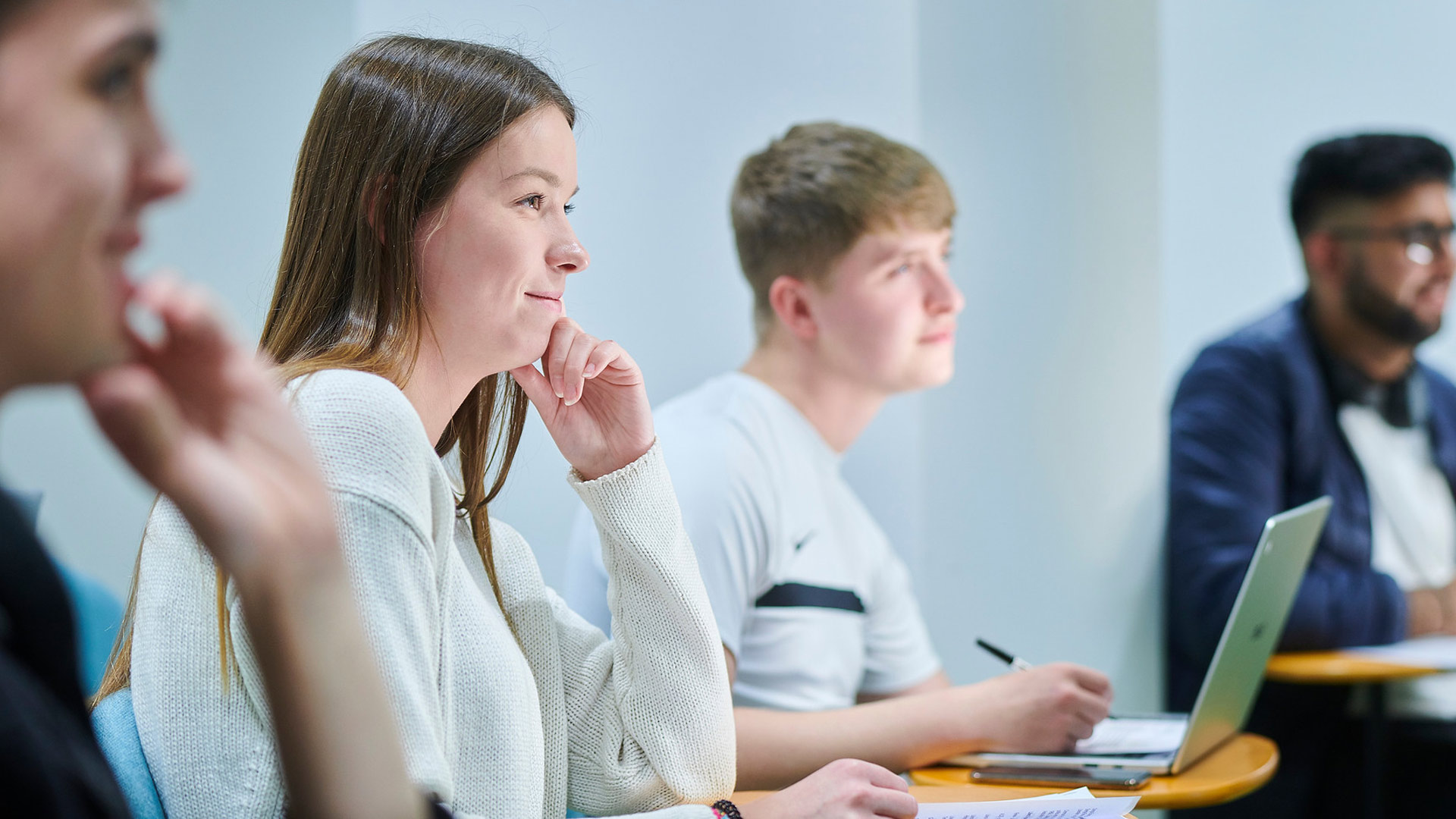 people in a subject session listening attentively 