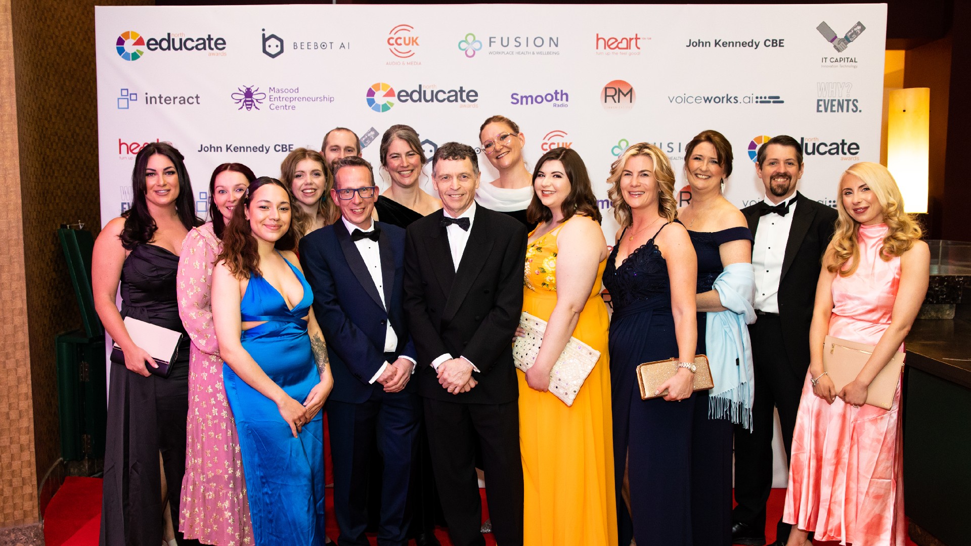 Edge Hill University staff at Educate North Awards 2023 holding a winning award.