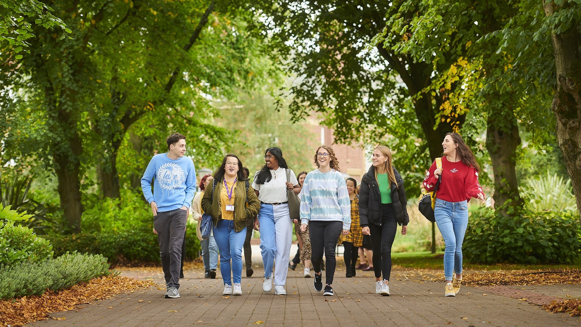 A group of students walking through campus