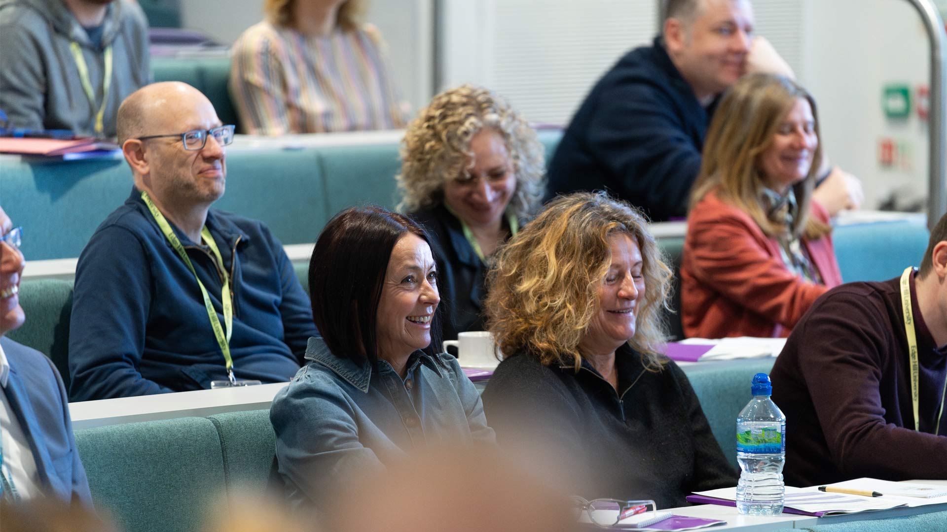 teachers sitting at a conference