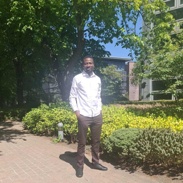 Jesse Ugwu stood on campus.
