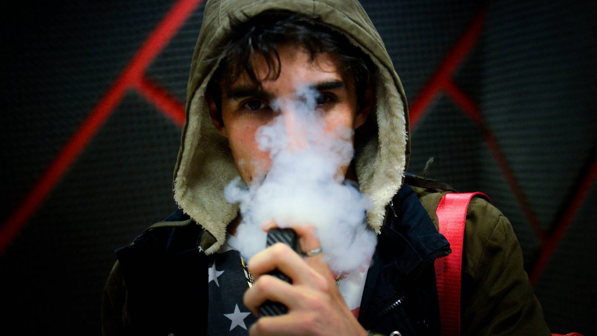 Hooded man vaping